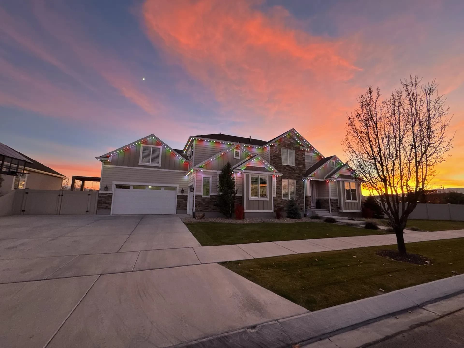 Craftsman-style home with warm permanent LED accent lighting